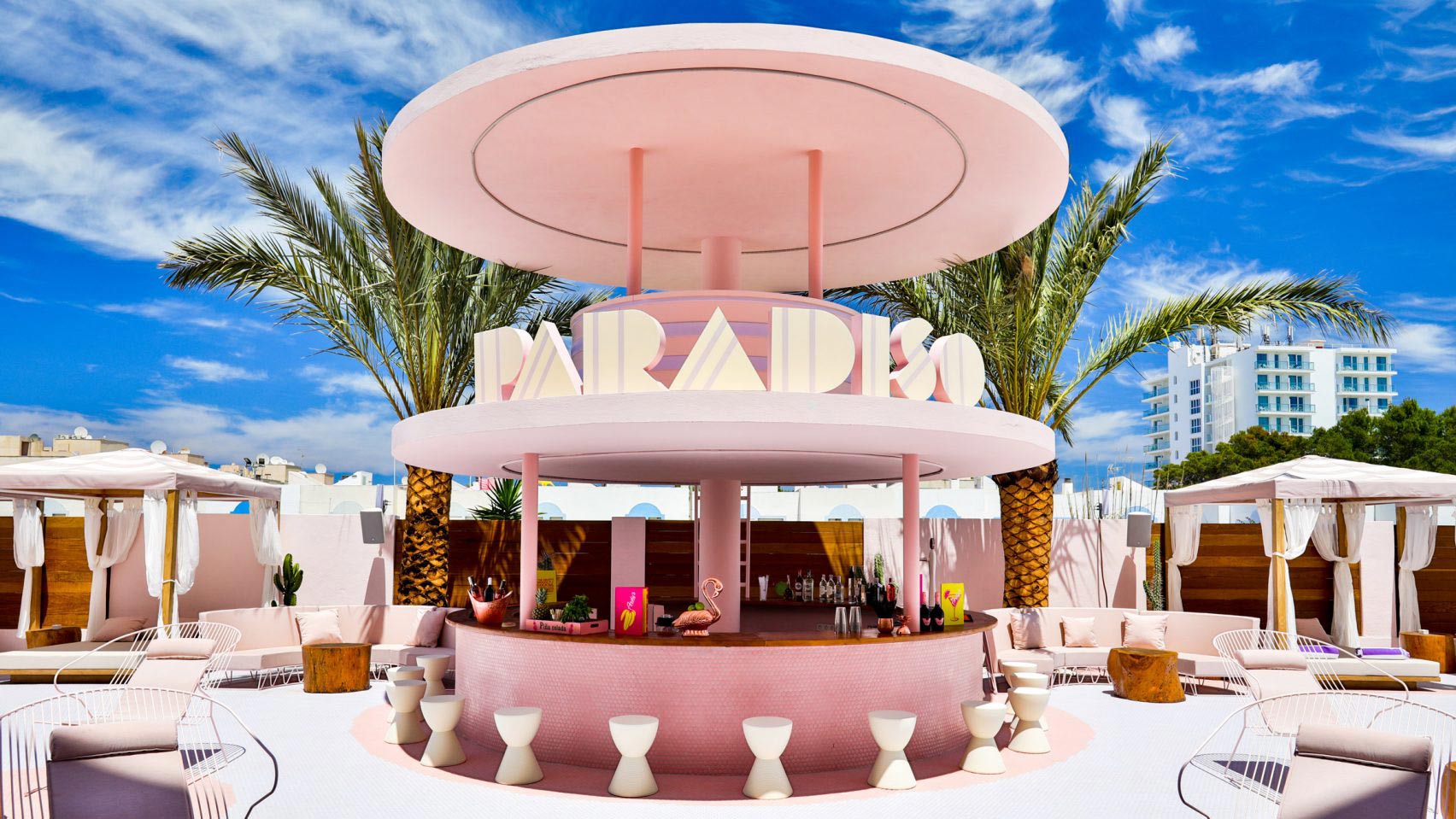 Hotel beach bar designed in Miami style with a signage name Paradiso